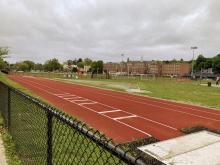 Track with soccer field, long jump area in foreground